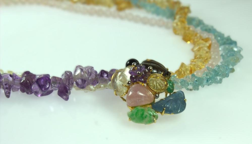 Multi-strand Rough-cut Gemstone Necklace with 14 carat Yellow Gold Clasp featuring carved stones