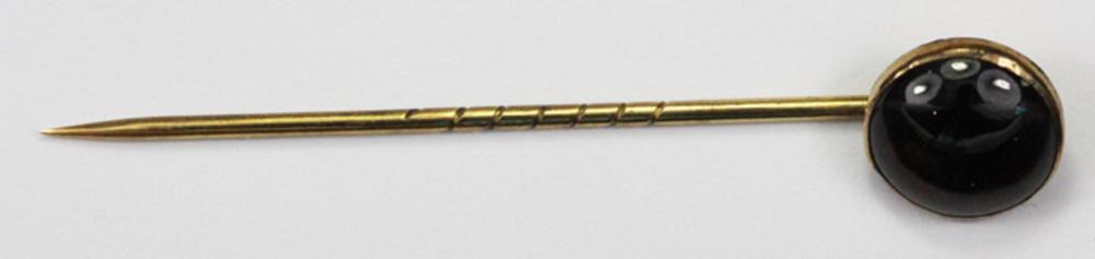 Elegant 9ct Gold Stick Pin with a polished domed Garnet